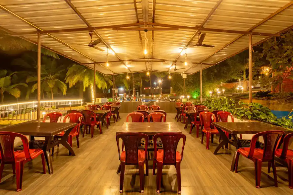 Indoor dining area with seating at Wild Mist resort Dandeli for group meals