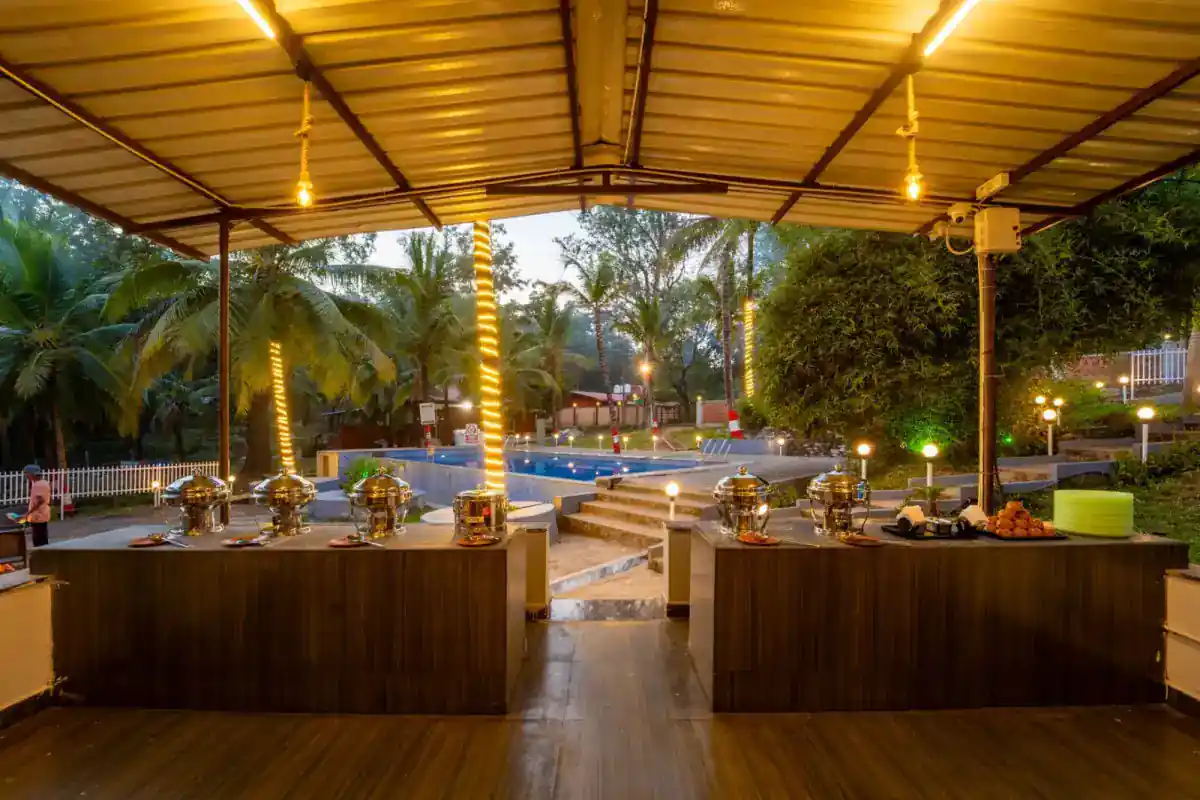 Spacious dining hall at Wild Mist Jungle Stay serving buffet meals in Dandeli