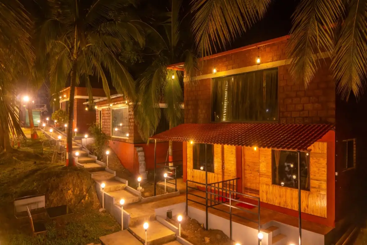 Wild Mist resort illuminated with decorative night lighting in Dandeli forest